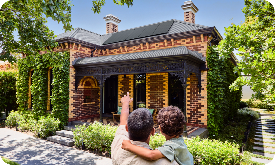Dad and child pointing at solar panels